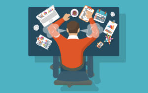 Image Of An Overworked Freelancer At His Desk - Search Influence