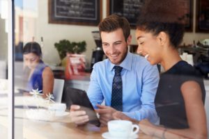 Image Of Coworkers Using A Mobile App - Search Influence