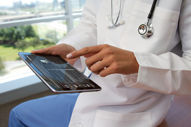Image of doctor using a tablet - Search Influence 
