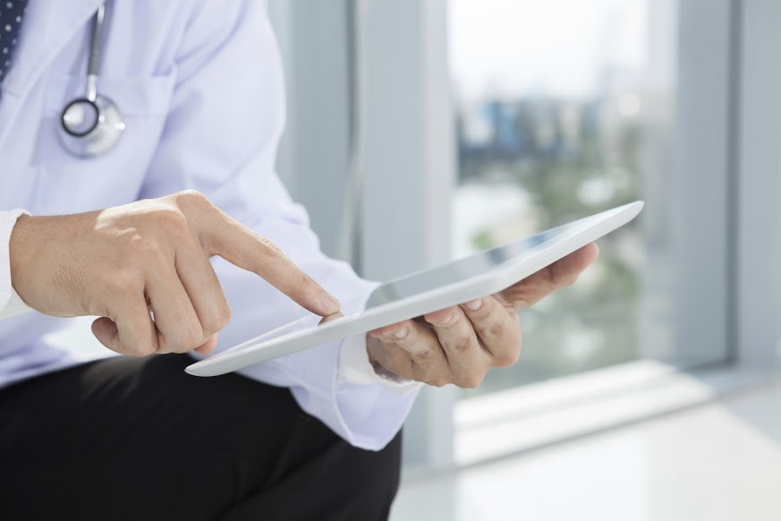 Physician holding a tablet