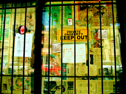 Door with bars and keep out sign - Search Influence