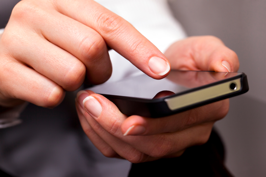 Man pointing his finger toward a smartphone's touchscreen - Search Influence