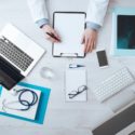 Image of a doctor writing on a clipboard - Search Influence