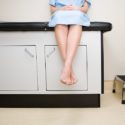 Patient Sitting On Treatment Couch - Search Influence