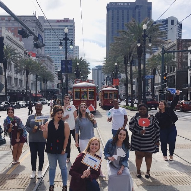 Search Influence employees posing on Canal Street for social media channels