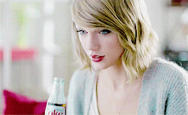 Taylor Swift drinking a Diet Coke
