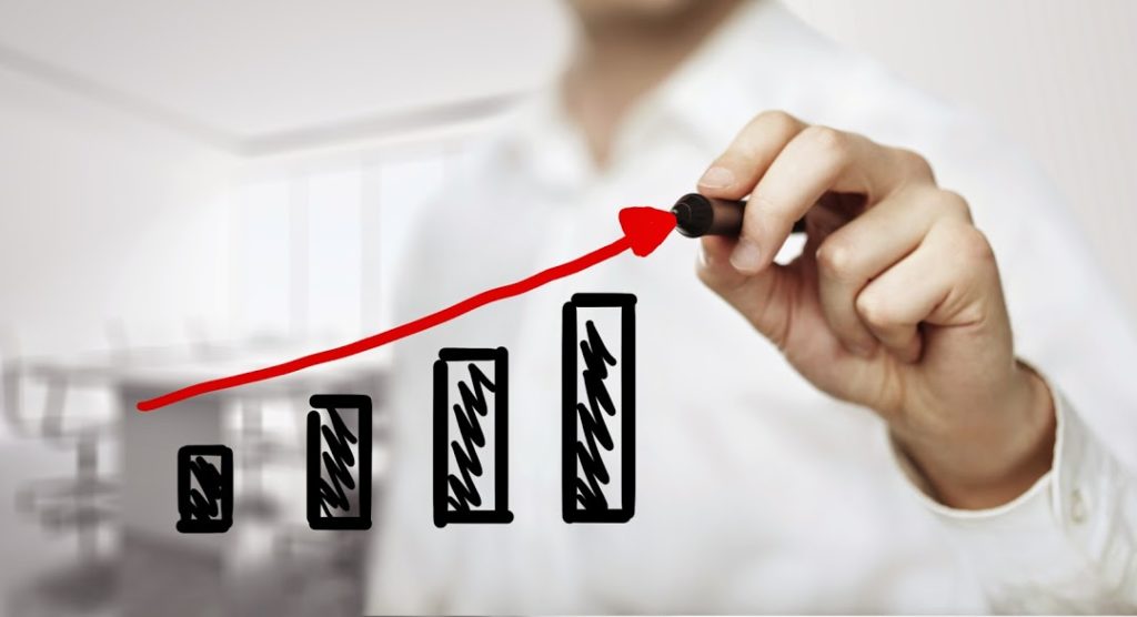 A man drawing a graph representing backlink growth through Search Influence in New Orleans, LA