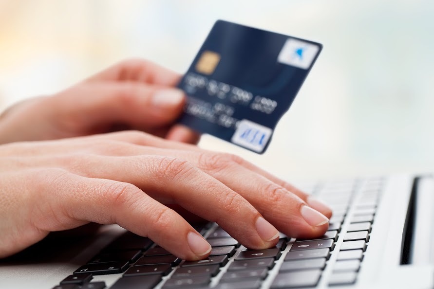Person using credit card to make purchase on Google Shopping