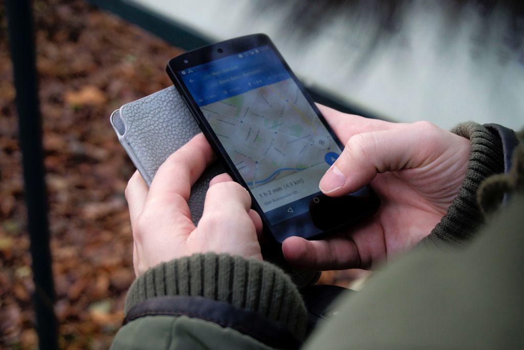 Person using their smartphone to access local business information