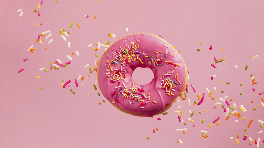 Donut with sprinkles and pink icing