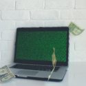 Money falling around computer trying to set up e-commerce tracking