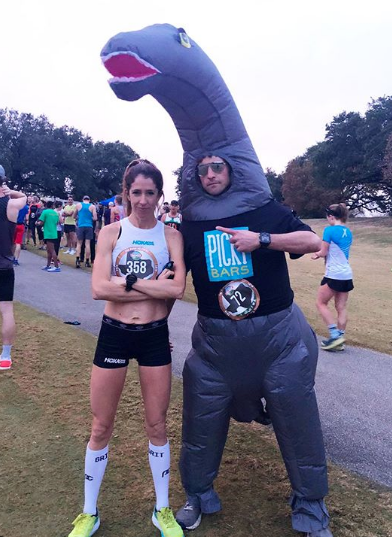 Pickybars owners posing in the Barosaurus costume at a race