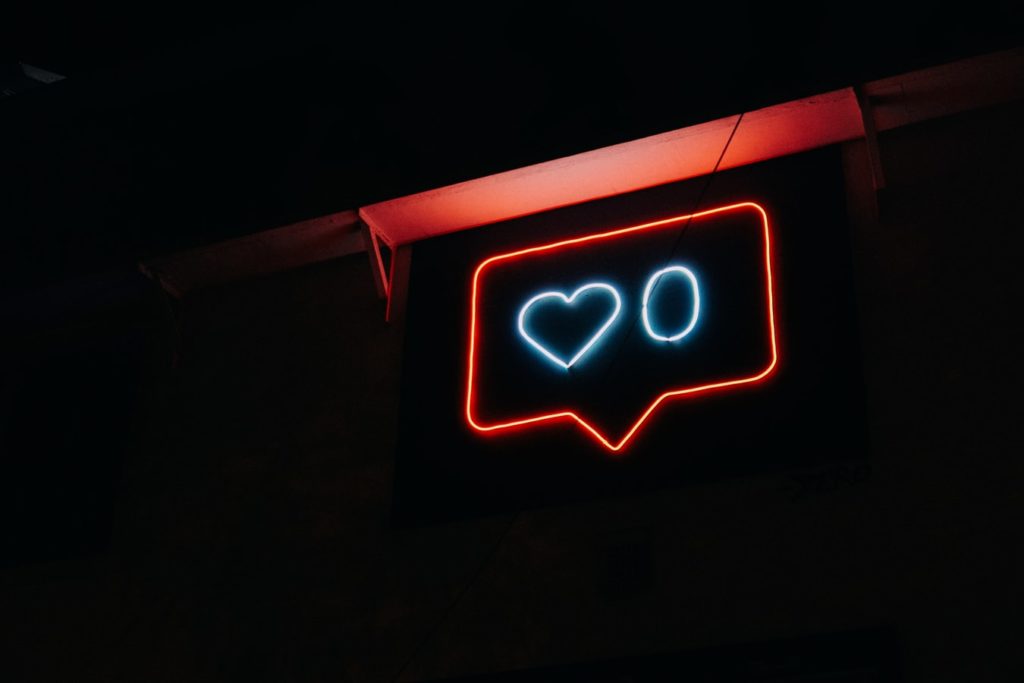 A neon sign of a heart and a 0