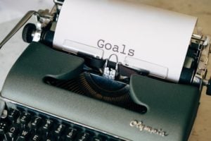 A typewriter spelling out the word goals