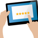 Graphic of a hand using a tablet to read online reviews of a business