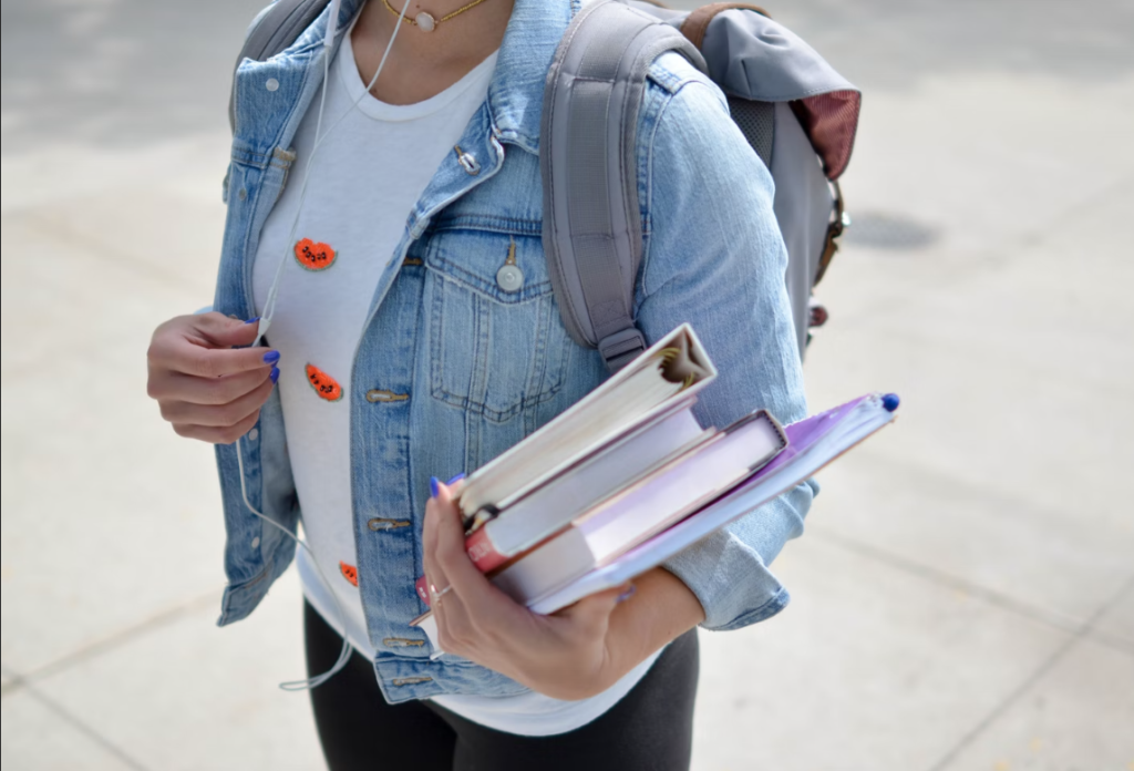 Student at university holding textbooks