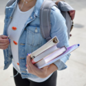 Student at university holding textbooks