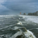 Waves crashing onto beach during a hurricane