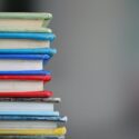 Photo of colorful books stacked on top of one another
