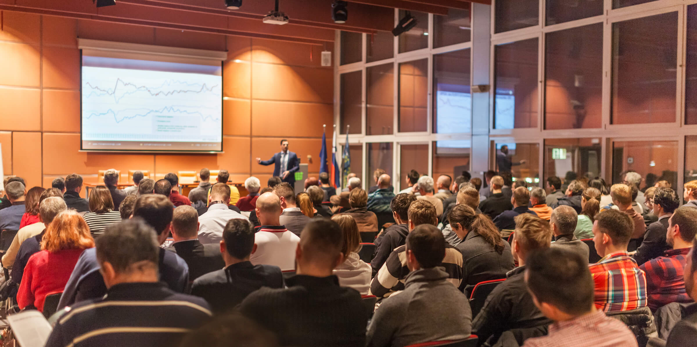 Image of a presentation to a large group at a higher education institution on digital marketing best practices.