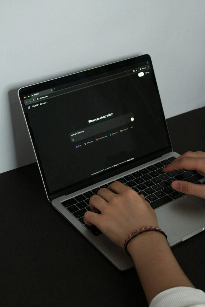 a-person-typing-on-a-laptop-on-a-table